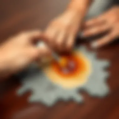 A person applying a stain remover on a tea stain